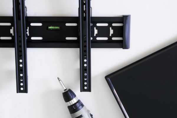 Wall-mounted TV with bracket and tools